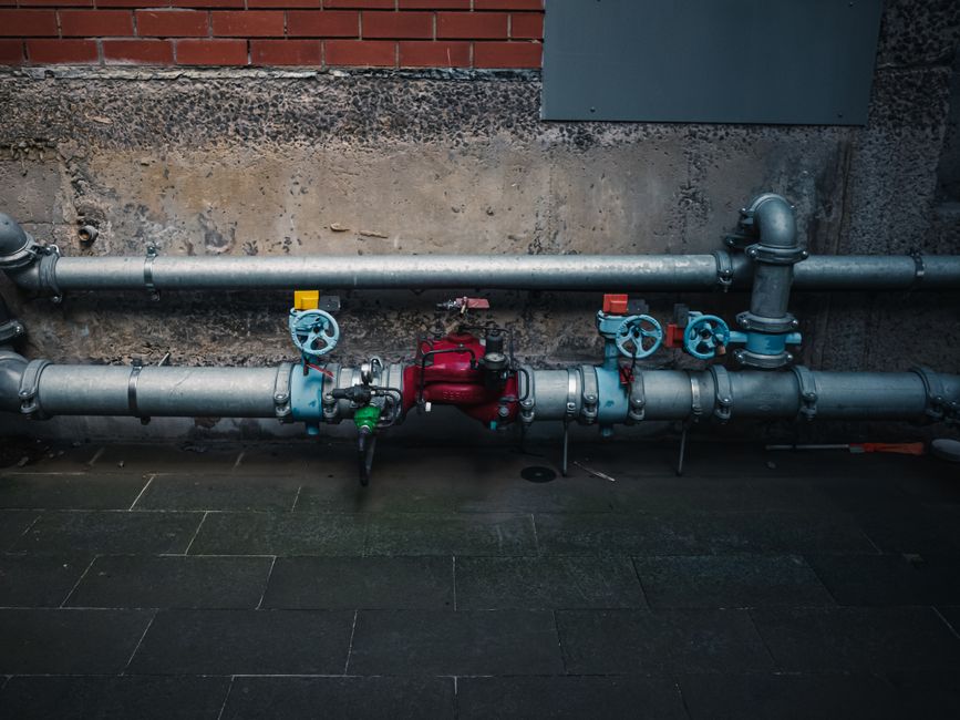 Industrial pipes with colorful valves — professional plumbing services in Modesto, CA by Premium Plumbing & Drain Inc.